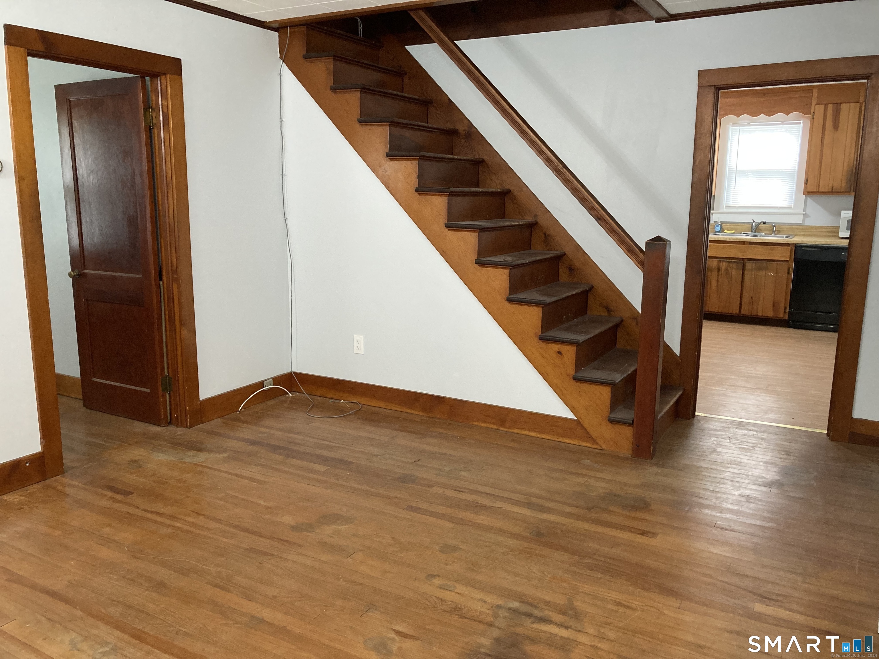282 Norwich-Westerly Road Preston, CT 06365 - Photo 1 of 11 a view of an entryway with wooden floor and stairs