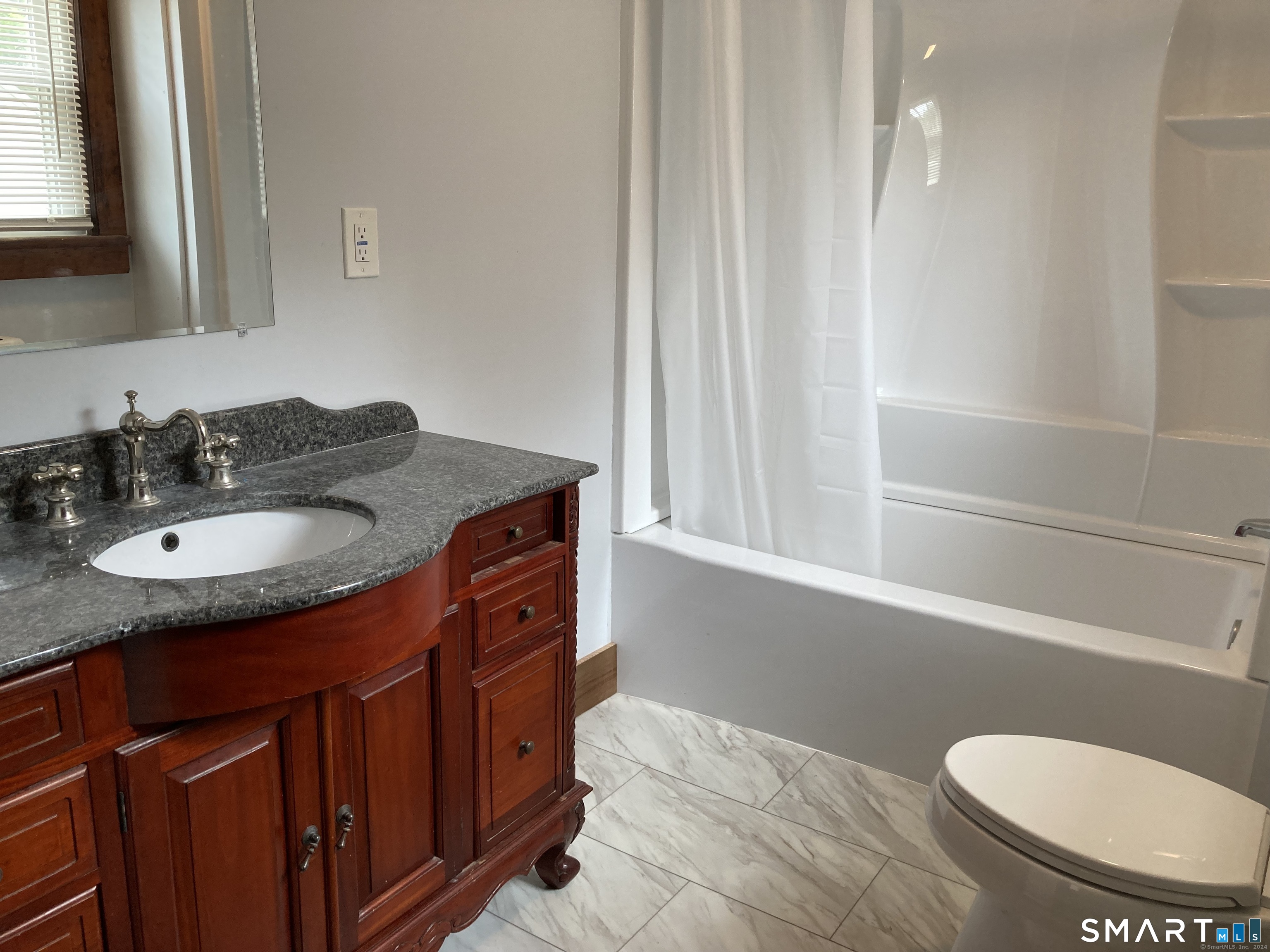 282 Norwich-Westerly Road Preston, CT 06365 - Photo 2 of 11 a bathroom with a granite countertop sink toilet and shower