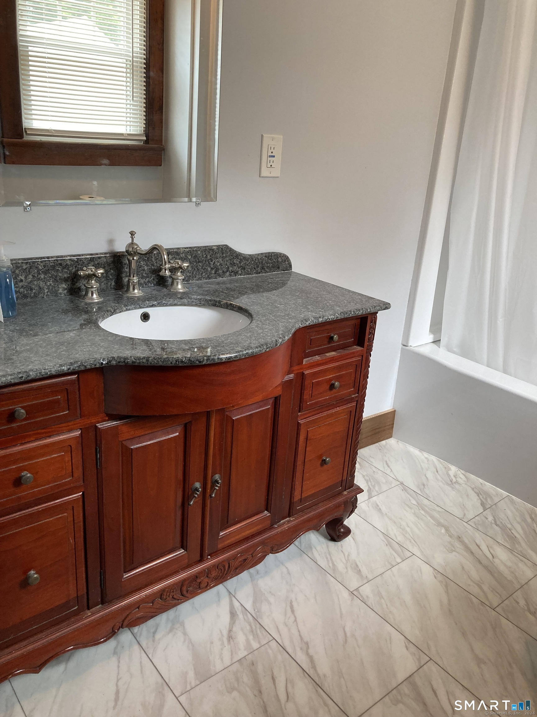 282 Norwich-Westerly Road Preston, CT 06365 - Photo 3 of 11 a bathroom with a sink and a mirror
