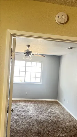 a kitchen with stainless steel appliances granite countertop a refrigerator and a stove