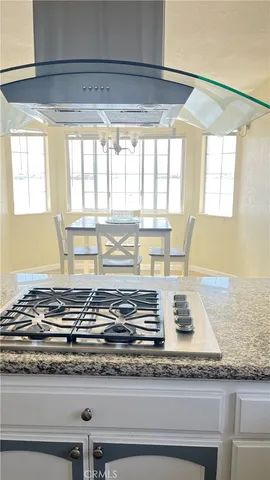 a view of a kitchen with granite countertop window and a sink