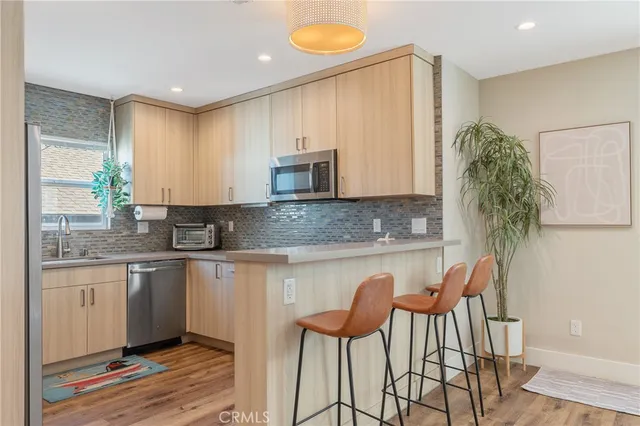 a kitchen with a sink stove and microwave