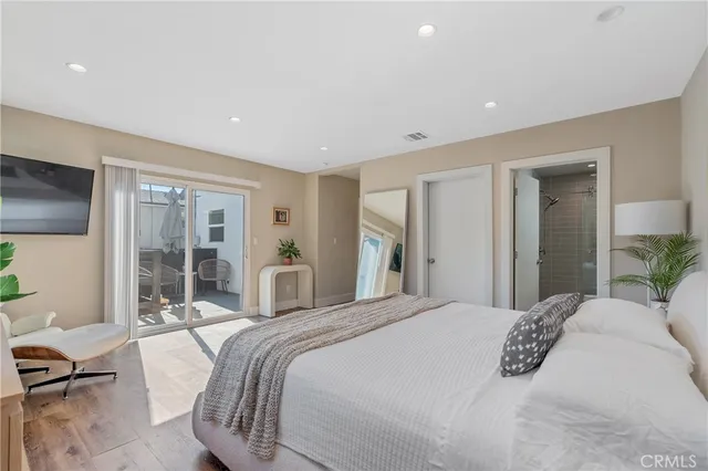 a spacious bedroom with a large bed and a window