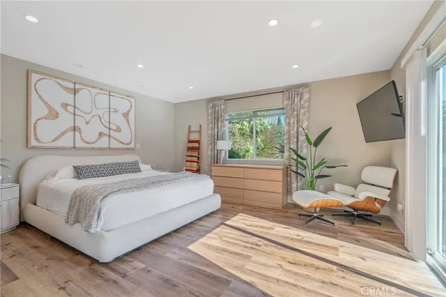 a bathroom with a sink granite toilet and shower