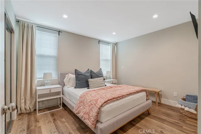 a bedroom with a bed and a television