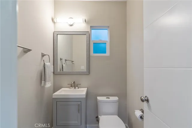 a bathroom with a toilet sink and tub