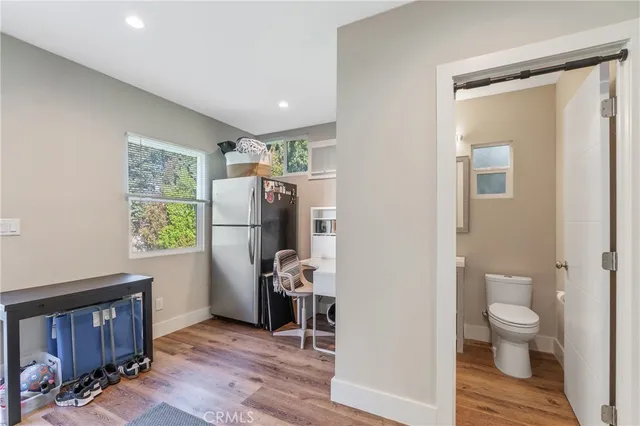 a view of a livingroom with furniture and hardwood floor