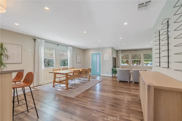a living room with furniture fireplace and a potted plant