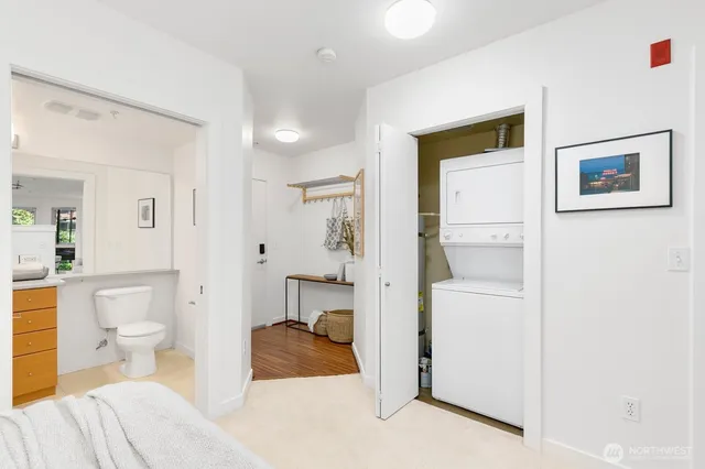 a spacious bedroom with a bed and a view of bathroom