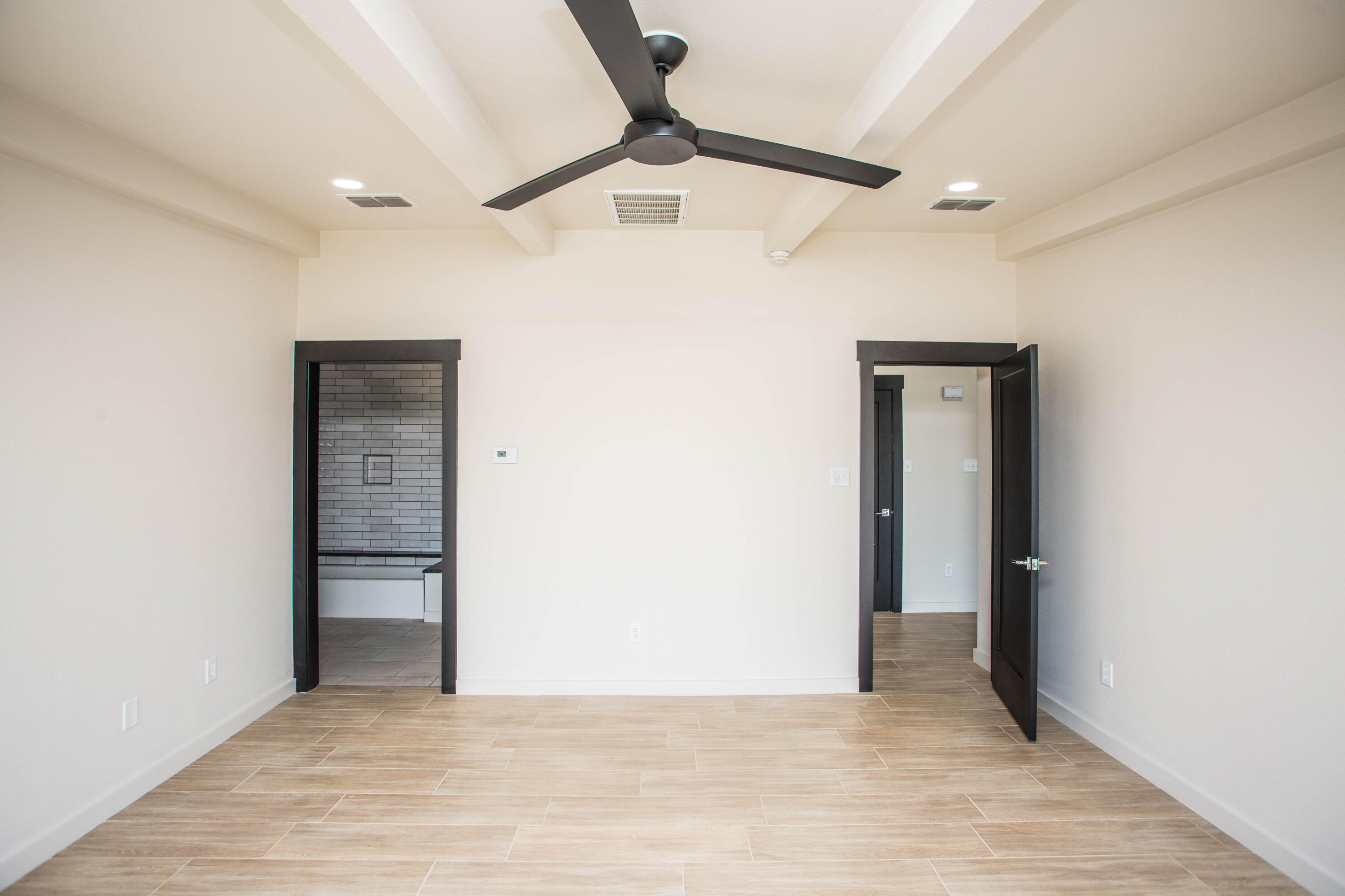 25 East Lakeshore Drive Ransom Canyon, TX 79366 - Photo 36 of 63 a view of an empty room with wooden floor