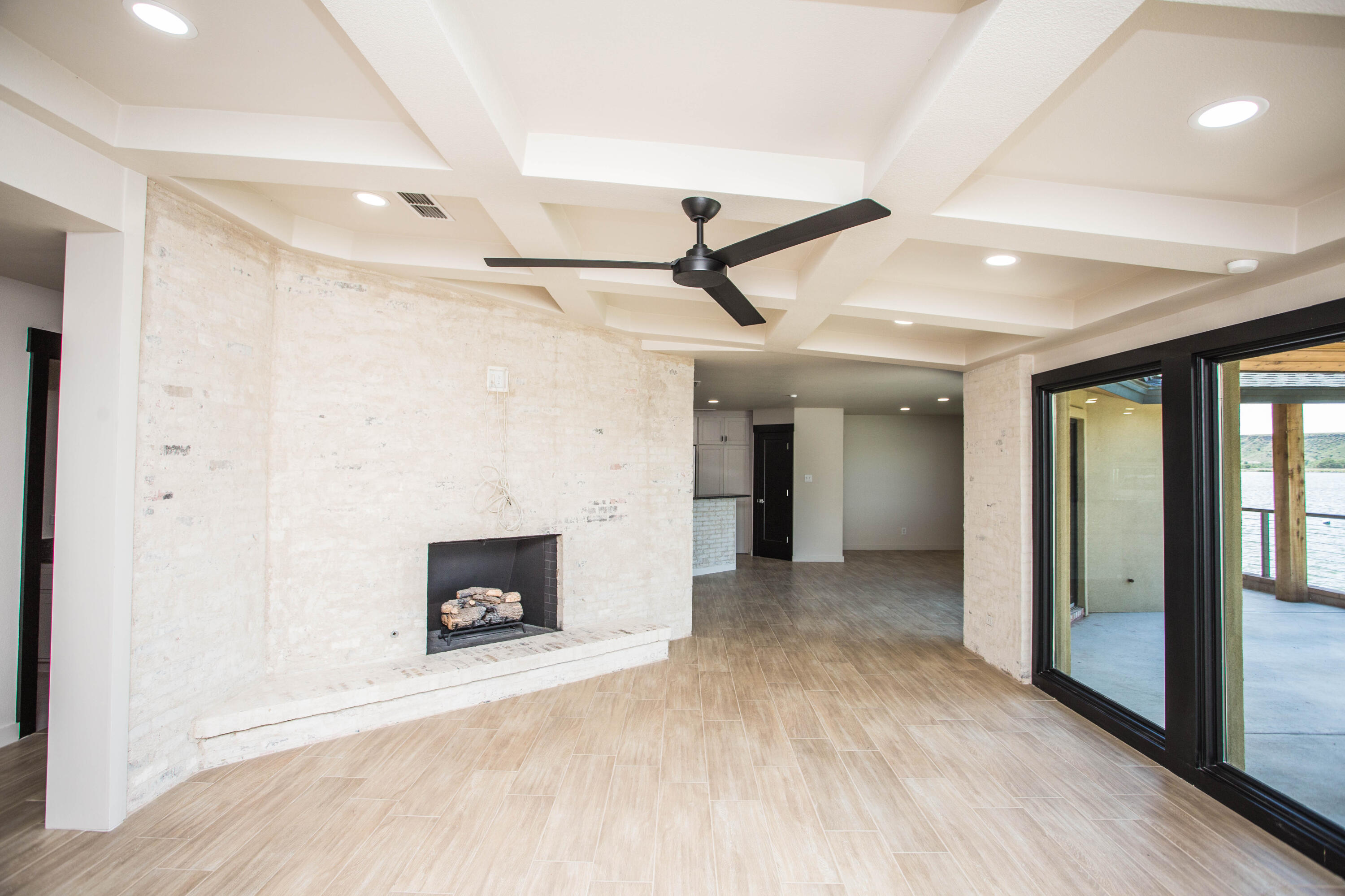 25 East Lakeshore Drive Ransom Canyon, TX 79366 - Photo 8 of 63 a view of a livingroom with a fireplace and window