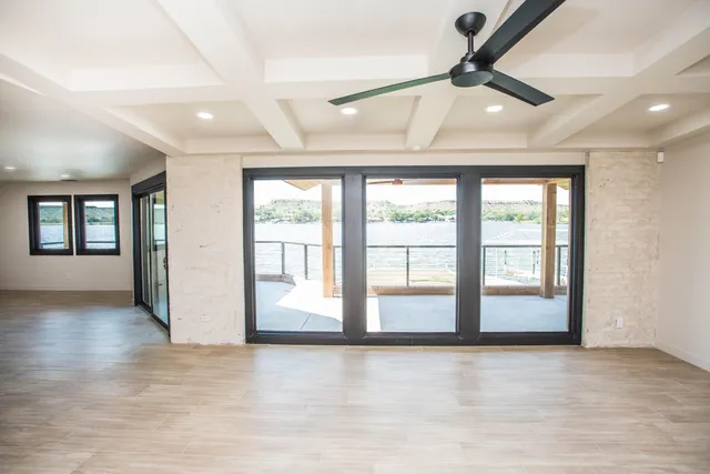 a view of hallway with wooden floor
