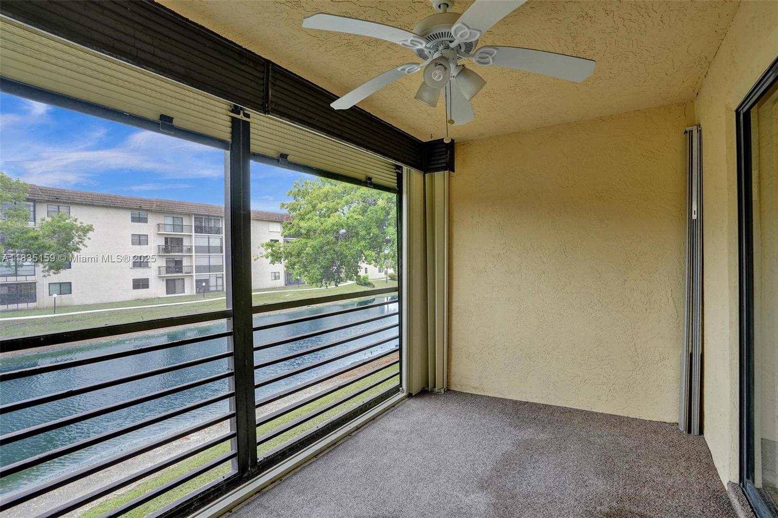 4965 East Sabal Palm Boulevard, Unit 207 Tamarac, FL 33319 - Photo 24 of 37 a view of a room with a large window