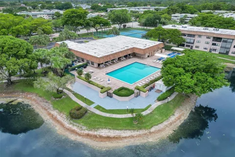 an aerial view of a house with a garden