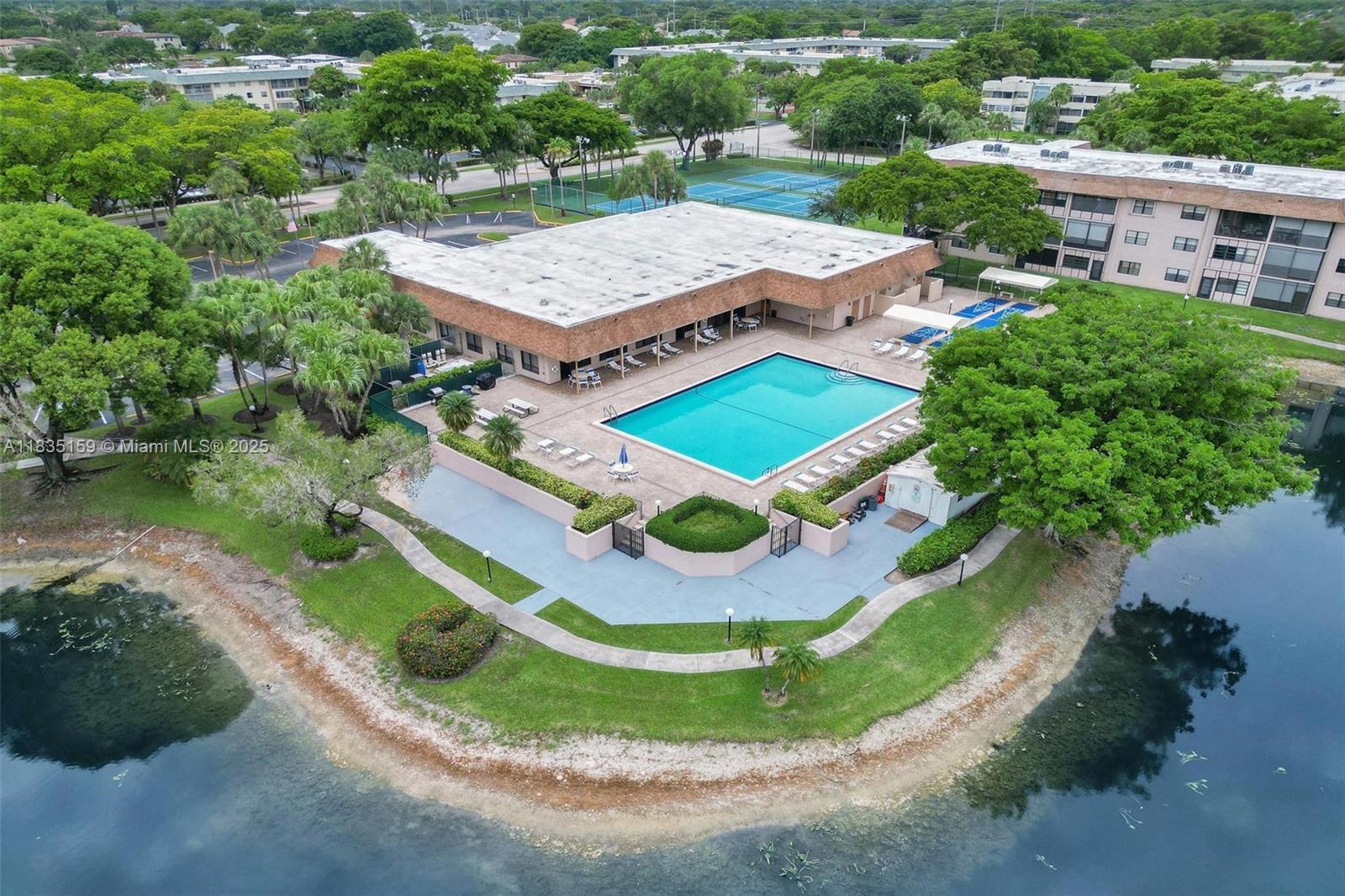 4965 East Sabal Palm Boulevard, Unit 207 Tamarac, FL 33319 - Photo 26 of 37 an aerial view of a house with a garden
