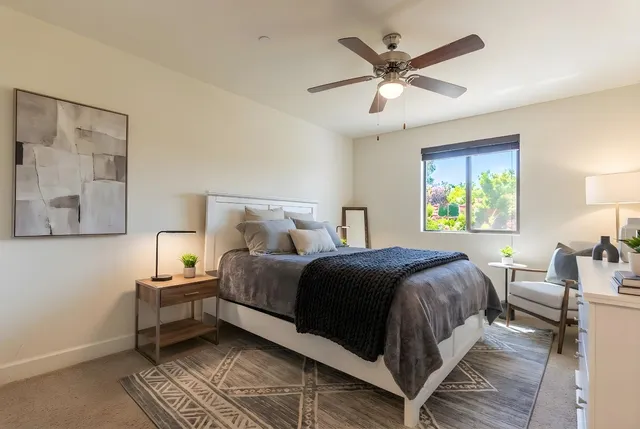 a bedroom with a bed and window