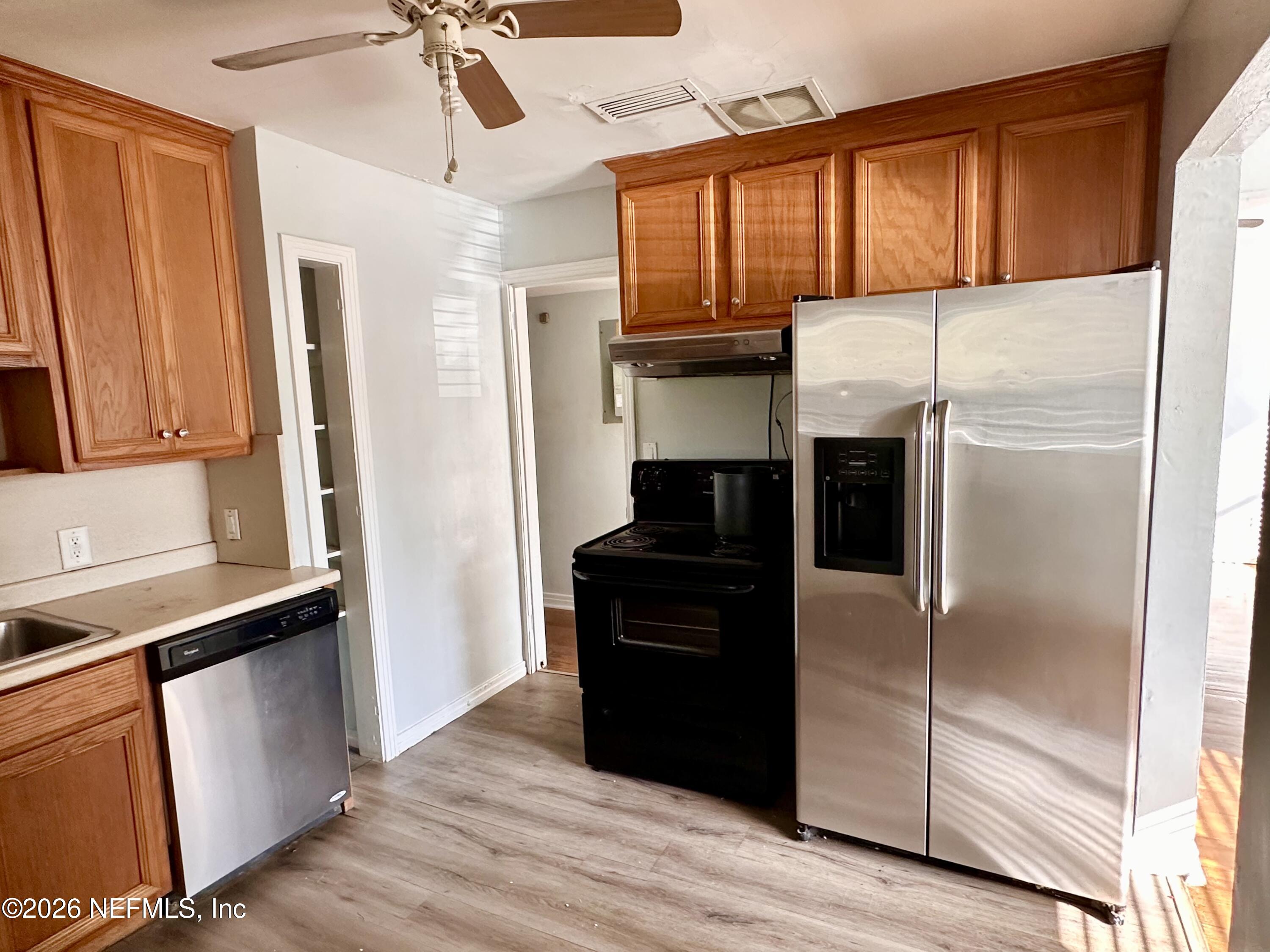 3638 Jammes Road Jacksonville, FL 32210 - Photo 11 of 31 a kitchen with a refrigerator and a stove