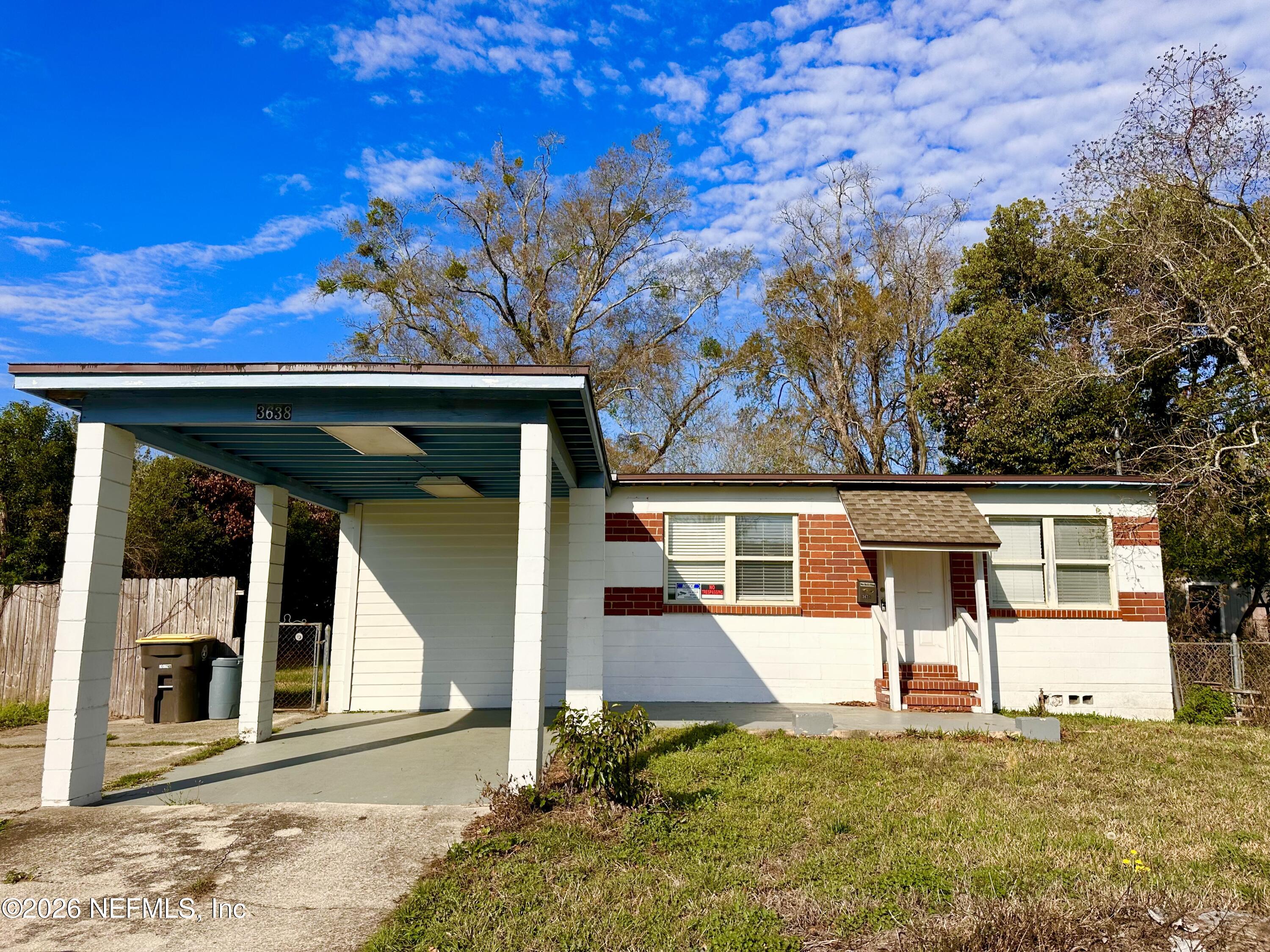 3638 Jammes Road Jacksonville, FL 32210 - Photo 2 of 31 front view of a house with a garage