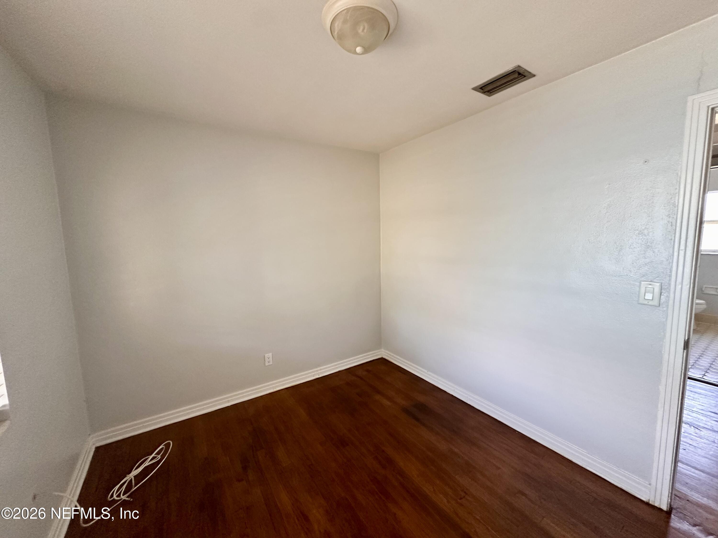 3638 Jammes Road Jacksonville, FL 32210 - Photo 26 of 31 a view of a room with wooden floor and fan