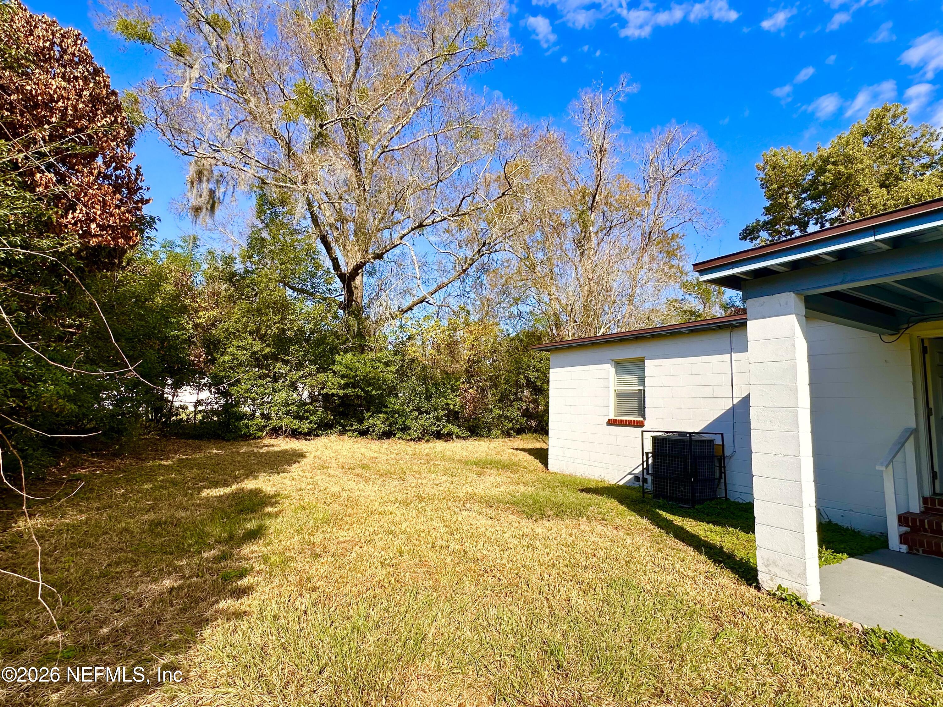 3638 Jammes Road Jacksonville, FL 32210 - Photo 30 of 31 a view of a house with a yard