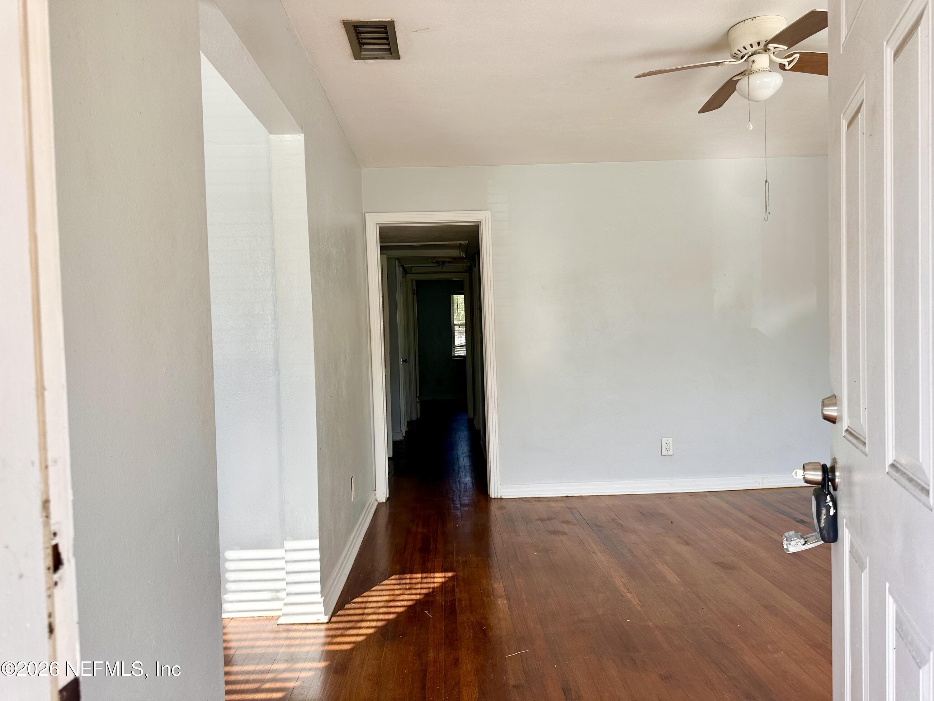 3638 Jammes Road Jacksonville, FL 32210 - Photo 4 of 31 a view of a room with wooden floor