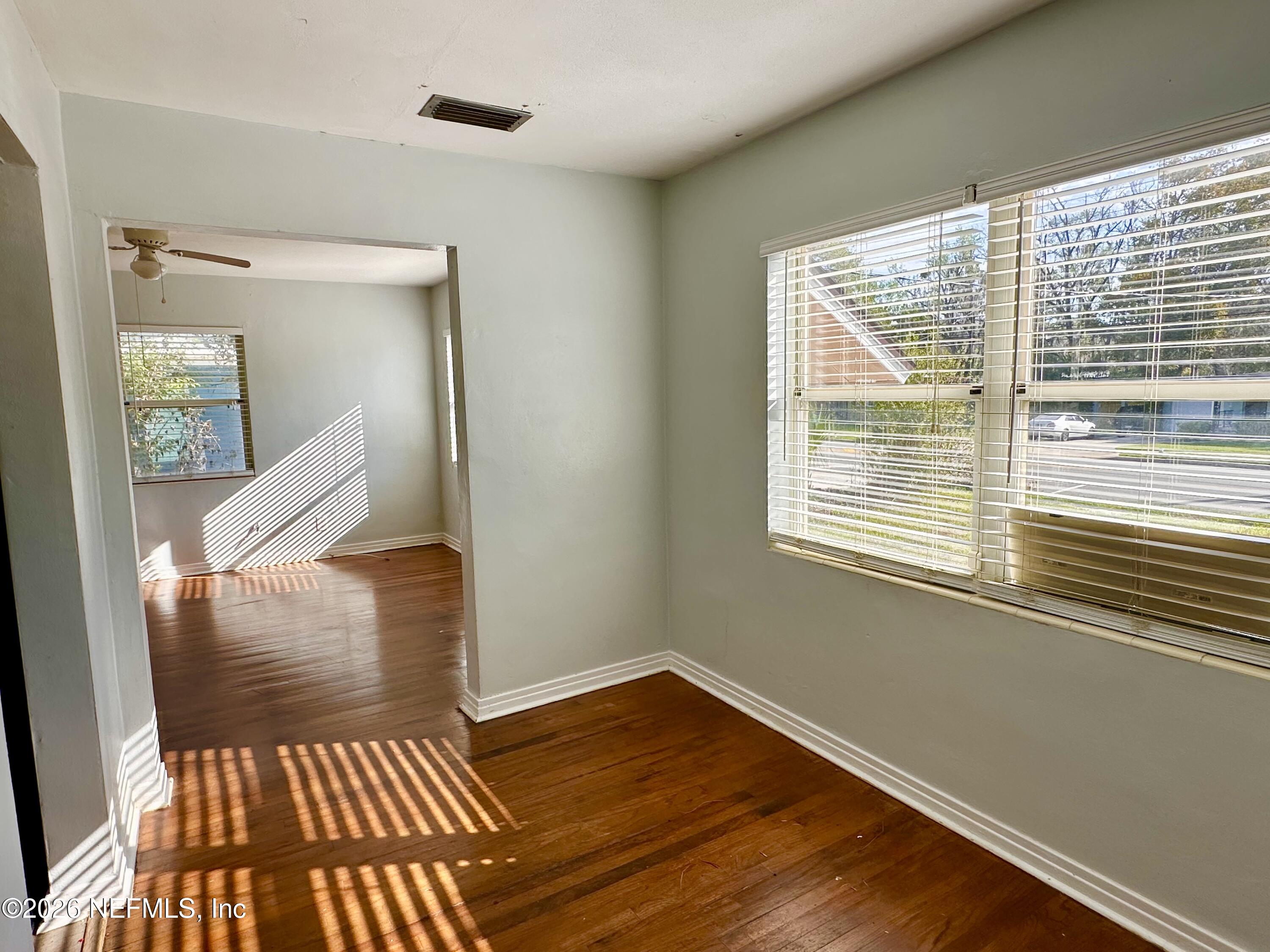3638 Jammes Road Jacksonville, FL 32210 - Photo 10 of 31 a view of a livingroom with wooden floor and a rug