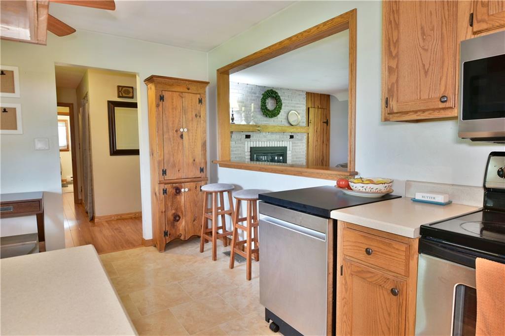 3631 Marr Road Pulaski, PA 16143 - Photo 5 of 25 a kitchen with stainless steel appliances kitchen island a stove a sink and a refrigerator