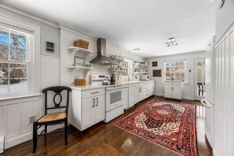 a kitchen with stainless steel appliances granite countertop a refrigerator and stove