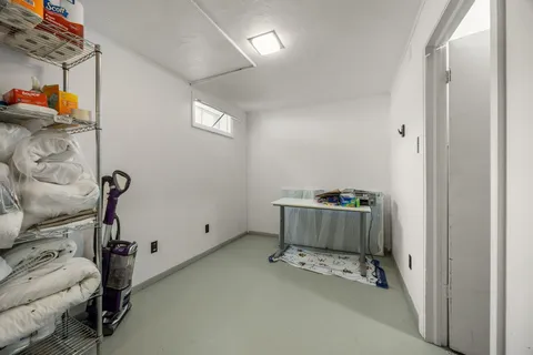 a room with a window and gym equipment