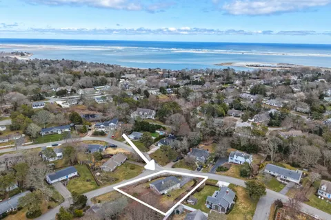 an aerial view of residential building and ocean