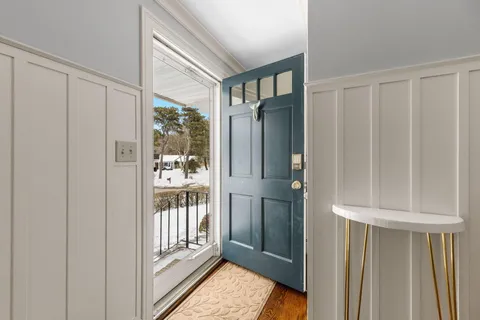 a view of a closet area with living room