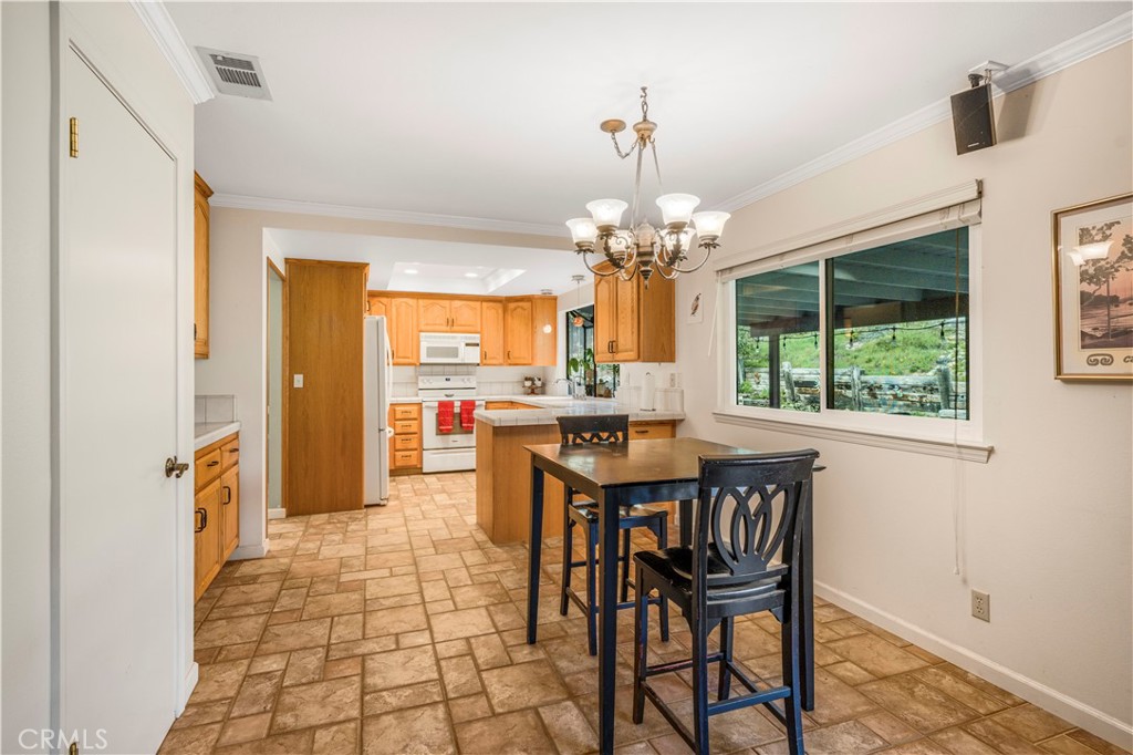 4648 Marlene Drive Santa Maria, CA 93455 - Photo 11 of 37 a view of a dining room with furniture and a chandelier