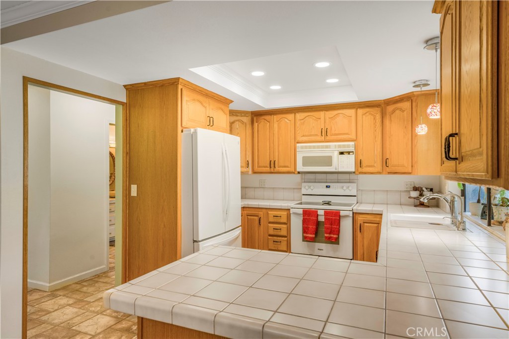 4648 Marlene Drive Santa Maria, CA 93455 - Photo 12 of 37 a kitchen with stainless steel appliances granite countertop a refrigerator and a stove