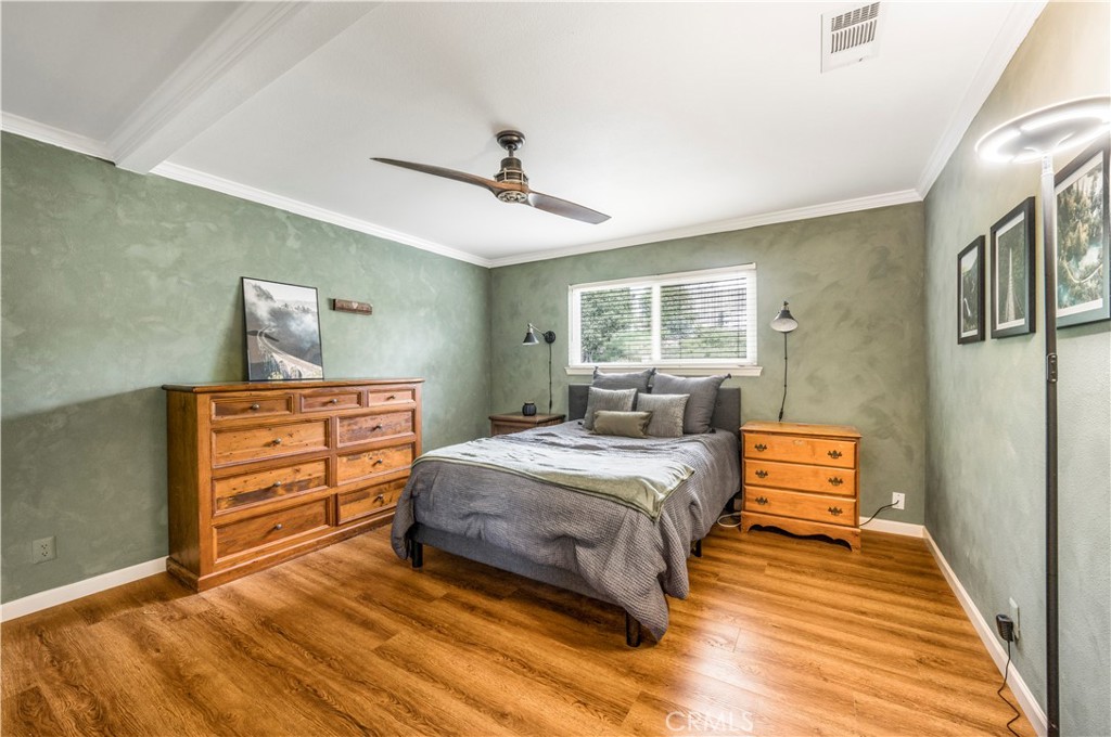 4648 Marlene Drive Santa Maria, CA 93455 - Photo 17 of 37 a bedroom with a bed and wooden floor