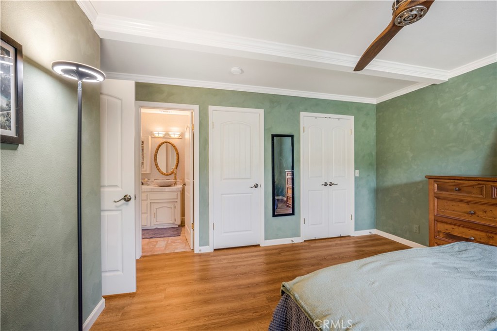 4648 Marlene Drive Santa Maria, CA 93455 - Photo 18 of 37 a bedroom with a bed and a chandelier