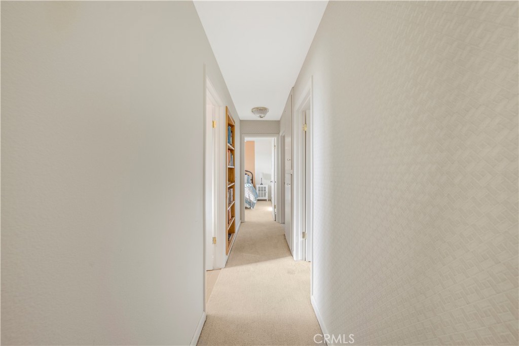 4648 Marlene Drive Santa Maria, CA 93455 - Photo 21 of 37 a view of a hallway with white walls and a white door