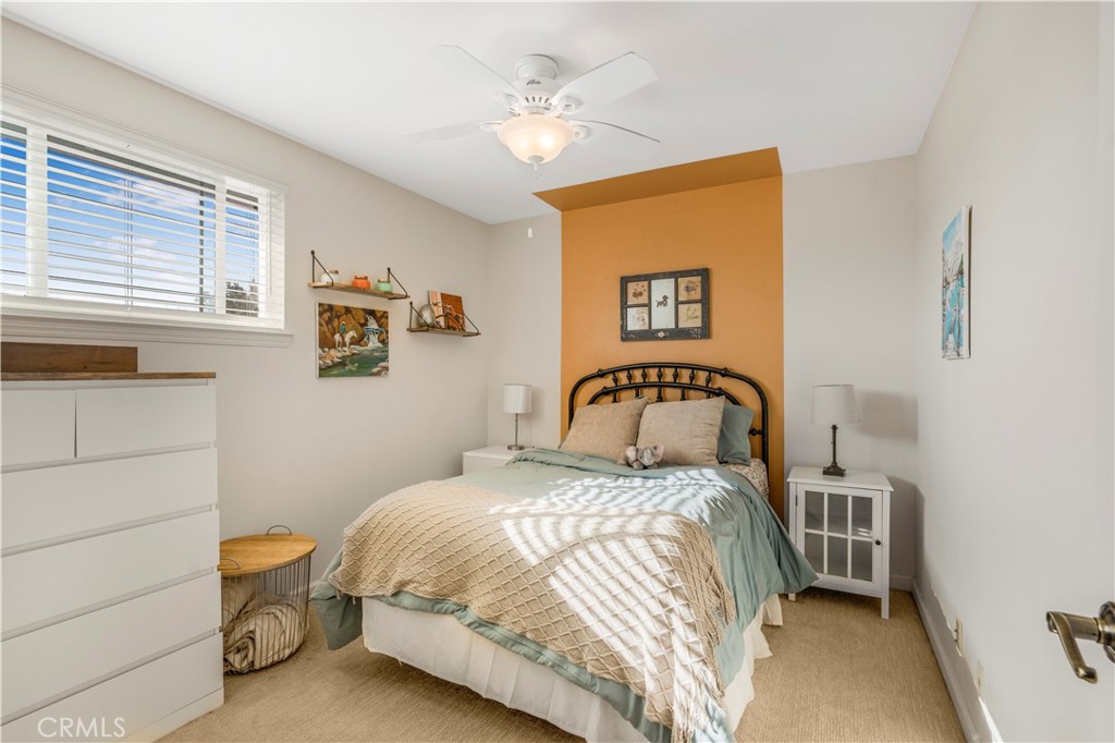 4648 Marlene Drive Santa Maria, CA 93455 - Photo 22 of 37 a bedroom with a bed and a chandelier