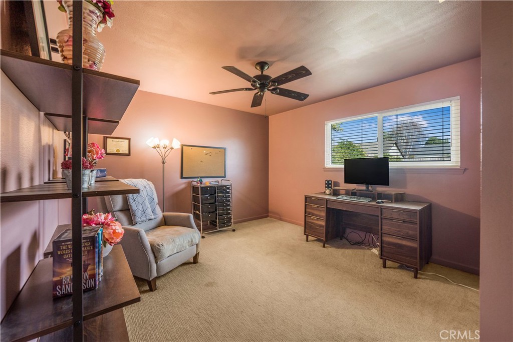 4648 Marlene Drive Santa Maria, CA 93455 - Photo 24 of 37 a bedroom with furniture and a chandelier