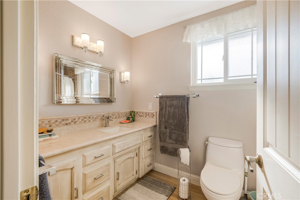 4648 Marlene Drive Santa Maria, CA 93455 - Photo 25 of 37 a bathroom with a toilet sink and mirror