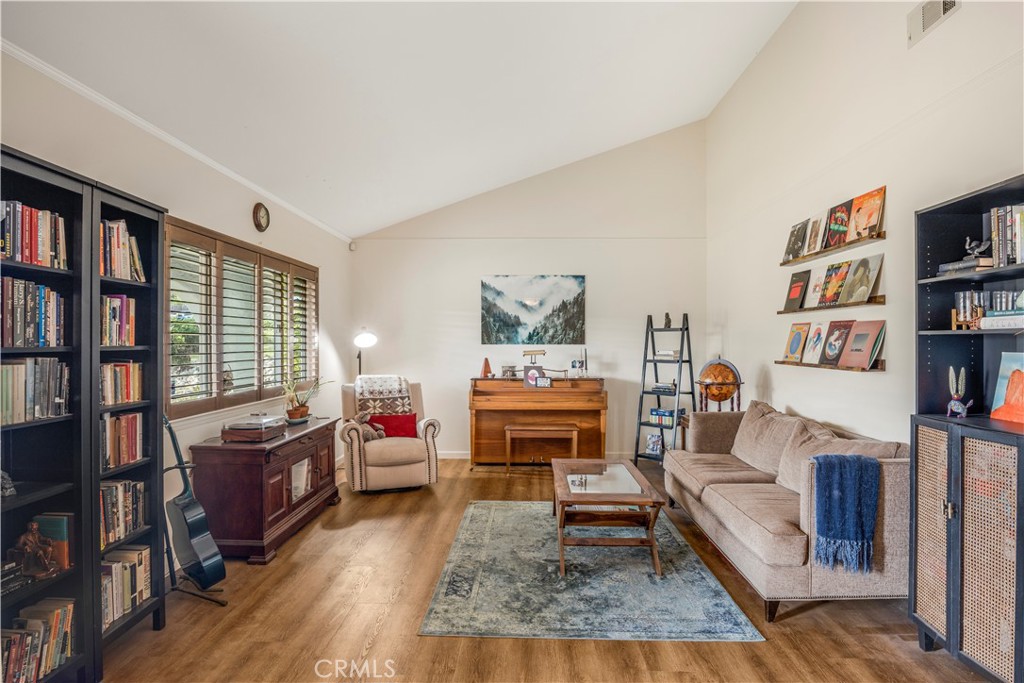 4648 Marlene Drive Santa Maria, CA 93455 - Photo 6 of 37 a living room with furniture and a book shelf