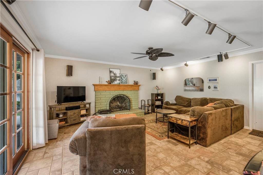 4648 Marlene Drive Santa Maria, CA 93455 - Photo 8 of 37 a living room with furniture a flat screen tv and a fireplace