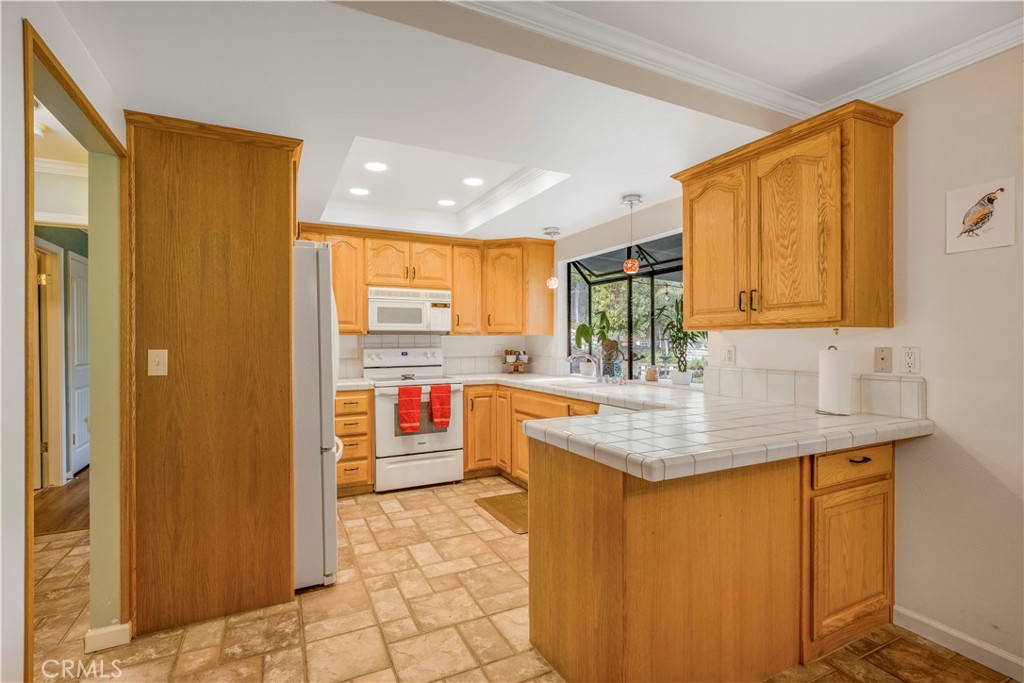 4648 Marlene Drive Santa Maria, CA 93455 - Photo 9 of 37 a kitchen with stainless steel appliances granite countertop sink stove and refrigerator