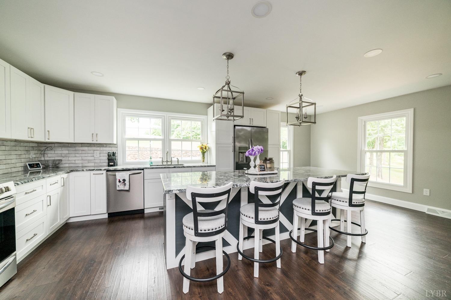 5335 Perrowville Road Forest, VA 24551 - Photo 26 of 65 a view of a dining room with furniture and wooden floor