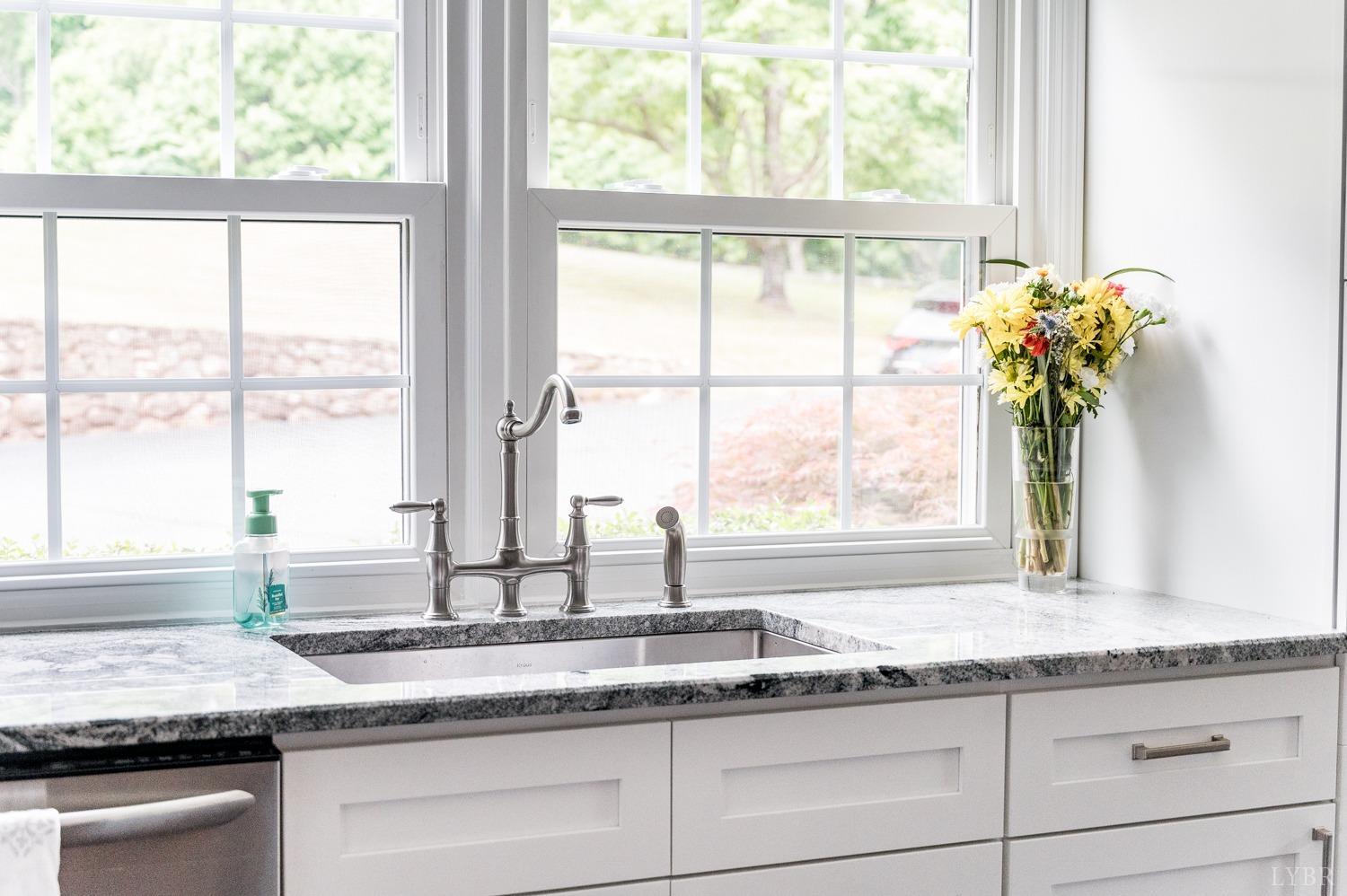 5335 Perrowville Road Forest, VA 24551 - Photo 29 of 65 a kitchen with granite countertop a window sink and cabinets