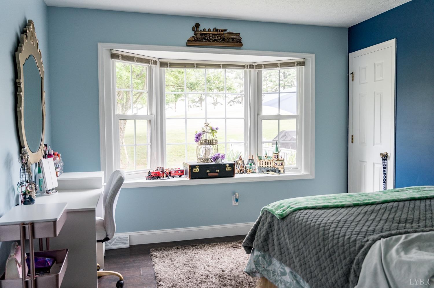 5335 Perrowville Road Forest, VA 24551 - Photo 55 of 65 a bedroom with a bed and large windows
