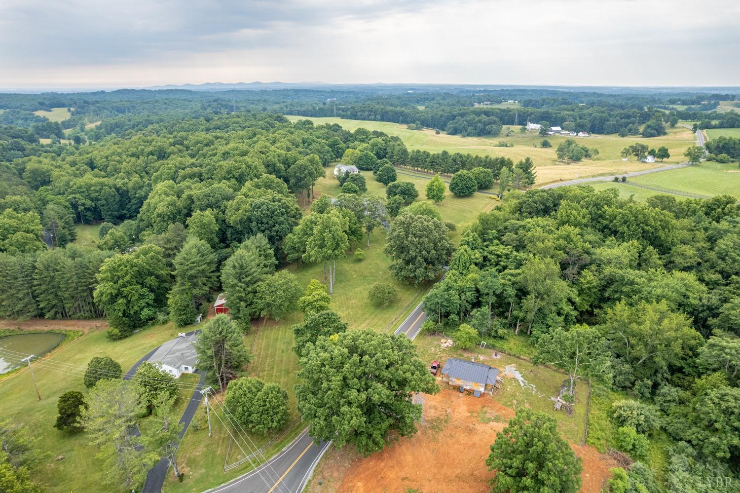 5335 Perrowville Road Forest, VA 24551 - Photo 63 of 65 an aerial view of residential houses with outdoor space and trees