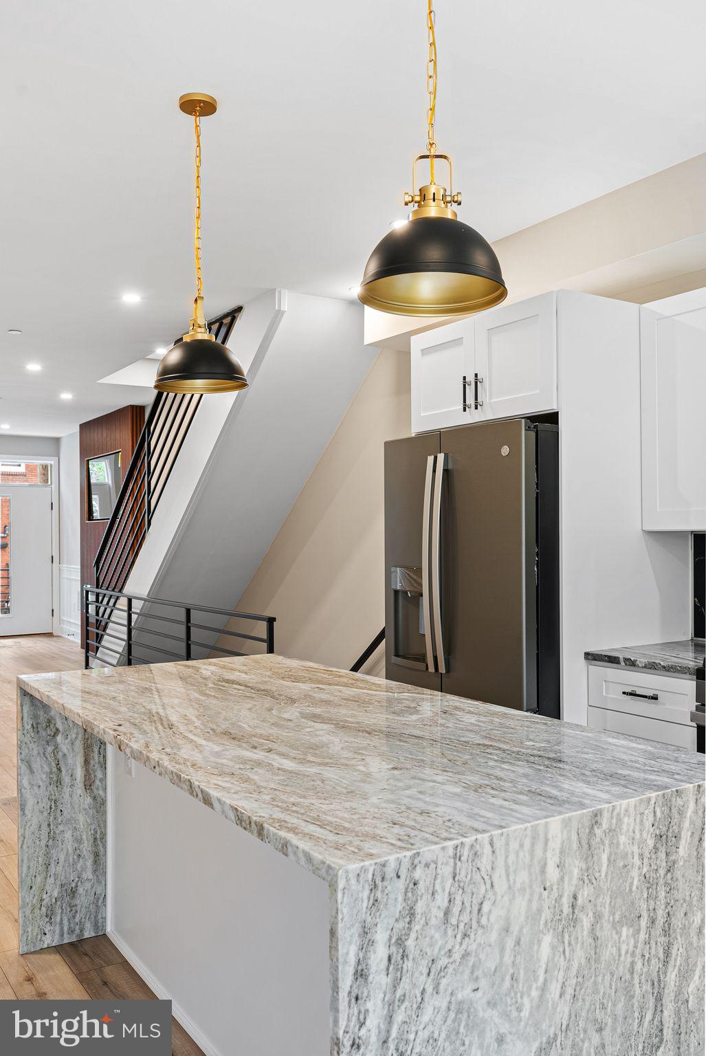 2722 Wharton Street Philadelphia, PA 19146 - Photo 13 of 46 a view of a kitchen with a sink and a chandelier