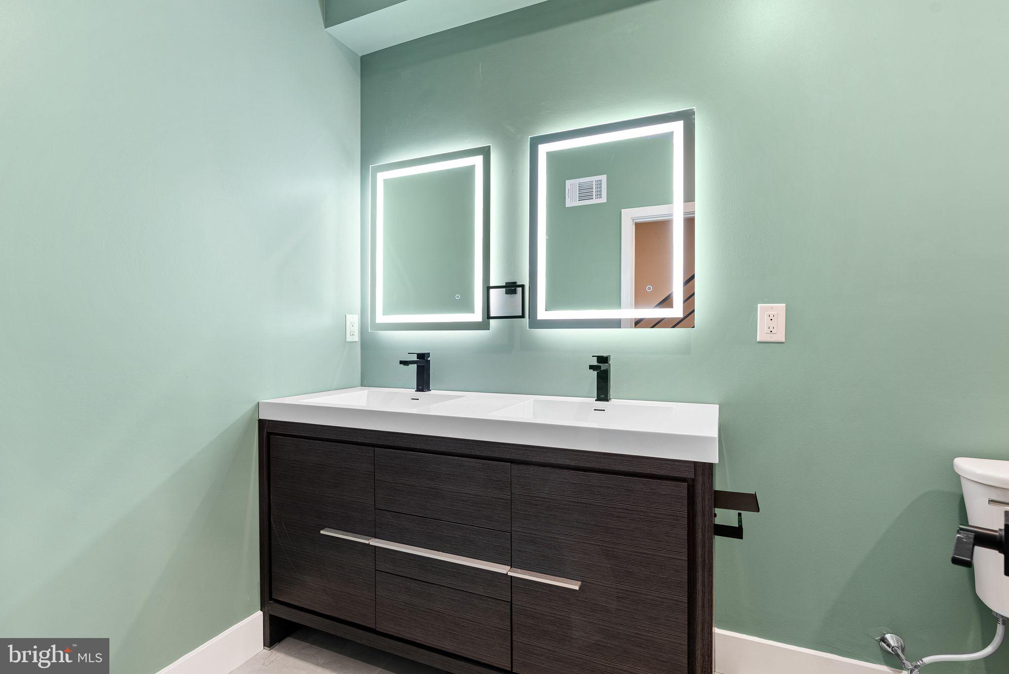 2722 Wharton Street Philadelphia, PA 19146 - Photo 35 of 46 a bathroom with a sink and a toilet