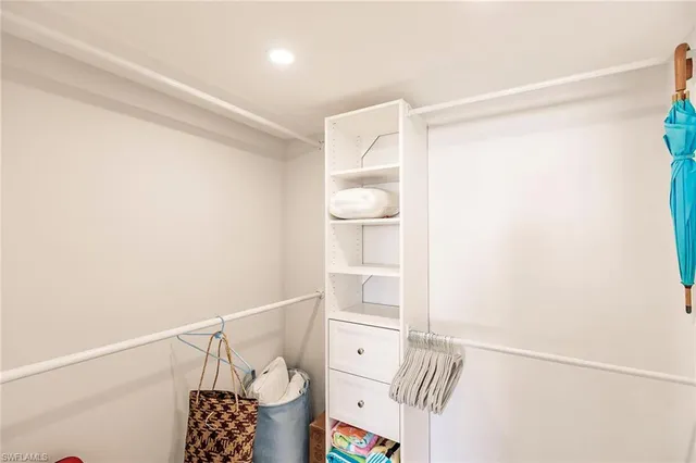 a bedroom with two beds and a window