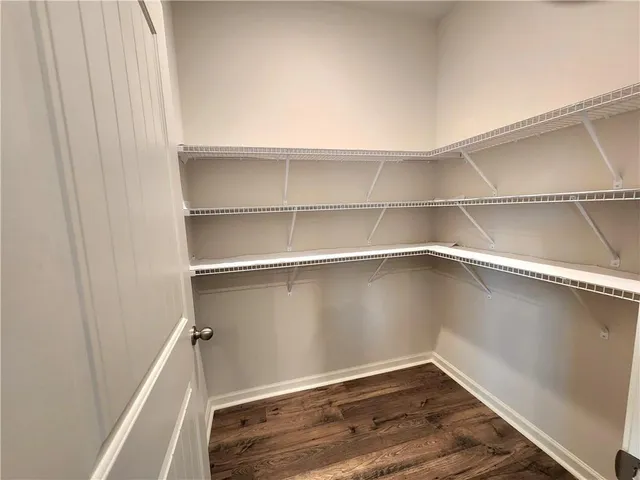 a view of an empty walk in closet